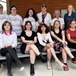 The following Rain Poetry participants are standing (back row) and seated (front row) Back from from left: Friends Memorial Library director Patty Kunicki, library support staff Brooke Lehman, library board of trustee Dani Newman, PA Wilds chief operating officer and PA Humanities board member Abbi Peters, library clerk and program director Anne Cleer, and Rain Poetry teaching artist and University of Pittsburgh at Bradford emeritus professor of writing Nancy McCabe. Front row from left: Rain Poetry poets Olivia Emer, Kya Haight, Aurora Forsythe, Allison Walters and Sophia Swanson at the Rain Poetry public reveal celebration in Kane.