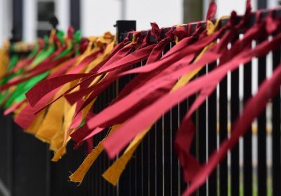 RIBBON TYING CEREMONY AT LINCOLN CEMETERY IN GREATER CARLISLE. PHOTO CREDIT: JASON MALMONT, THE SENTINEL