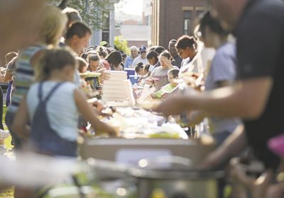 RESIDENTS OF MEADVILLE GATHER FOR THE WORLD'S LARGEST POTLUCK (IN MEADVILLE). PHOTO CREDIT: SHANNON ROAE/THE MEADVILLE TRIBUNE