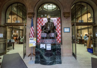 A BRONZE STATUE OF STEEL TYCOON BENJAMIN FRANKLIN JONES GREETS PATRONS TO THE BF JONES MEMORIAL LIBRARY IN ALIQUIPPA, PENNSYLVANIA.