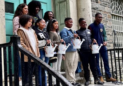 Student poets, teachers and facilitators who participated in the Rain Poetry workshop at Emlen Elementary pose after the students read their poems at Vernon Park on Saturday, May 20.
