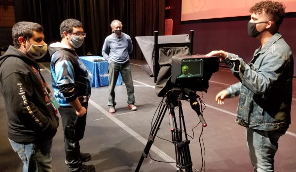 From left, Esperanza Arts Center mentor fellows and production assistants Emmanuel Figueroa and
Ozias Ayala join Bruce Savage, media production professor at Esperanza College, and 
Josue Lora, production manager for the LuminArias video series, in preparing for a filming.