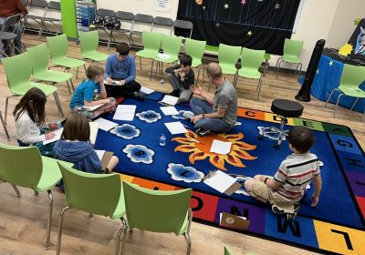 Teaching artist Eric Schwerer leads a Rain Poetry workshop with elementary school students at Cambria County Library.